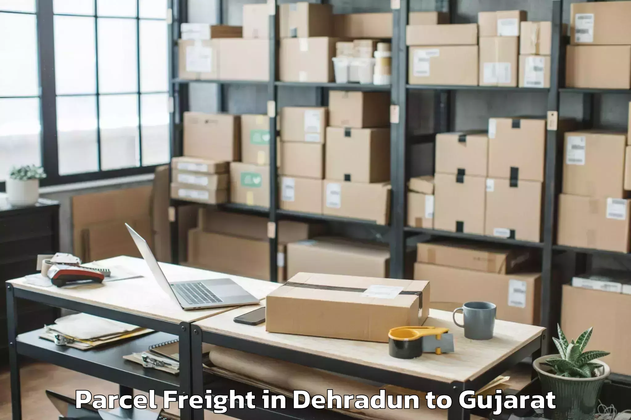 Top Dehradun to Nirma University Ahmedabad Parcel Freight Available